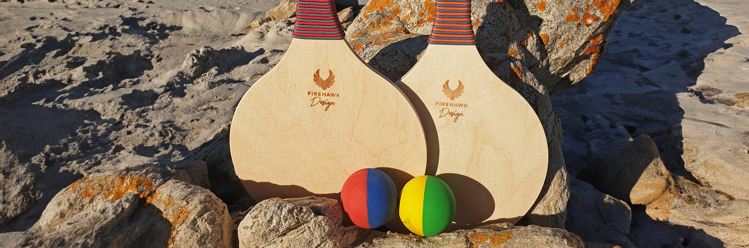 firehawk design beach bats with ball on the beach